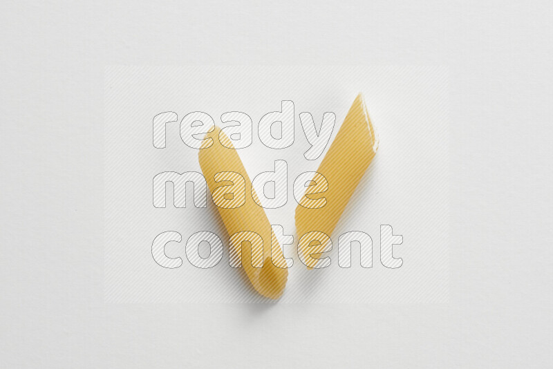 Penne pasta on white background