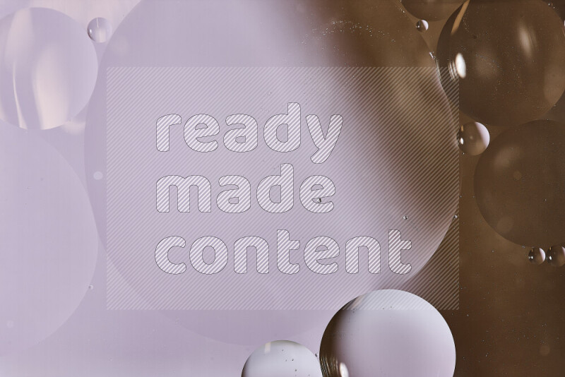 لقطات مقربة لفقاعات من الزيت على سطح الماء باللون الأبيض والبني