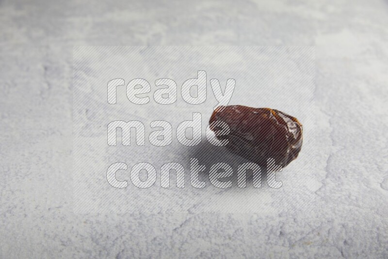 one madjoul date on a light grey background