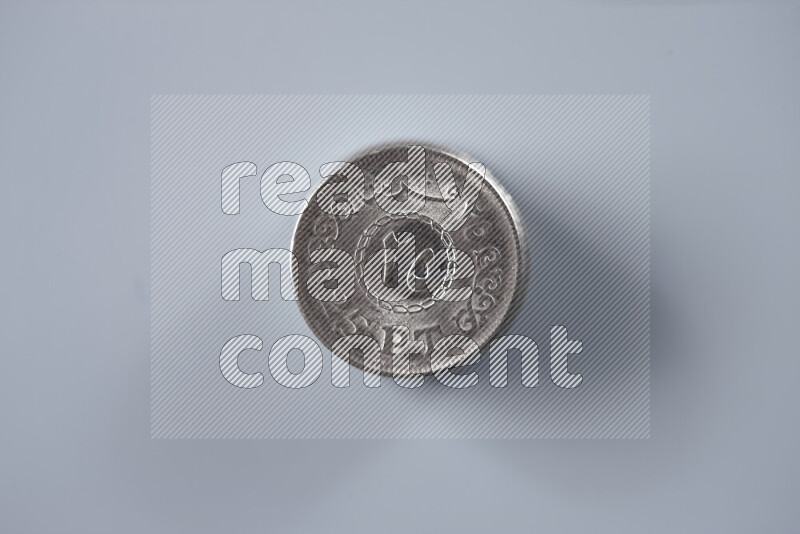 Stack Egyptian 25 piasters coins on grey background