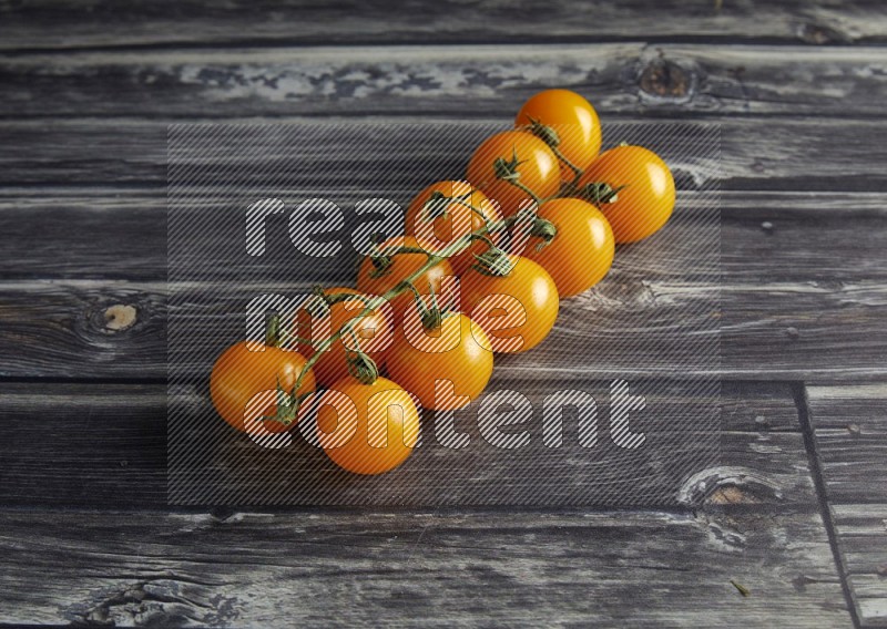 45 cherry tomato vein on a textured grey wooden background