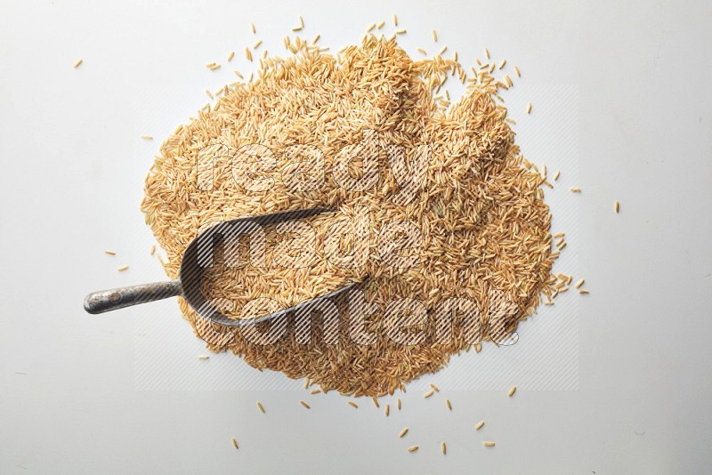 Long grain brown rice on white background