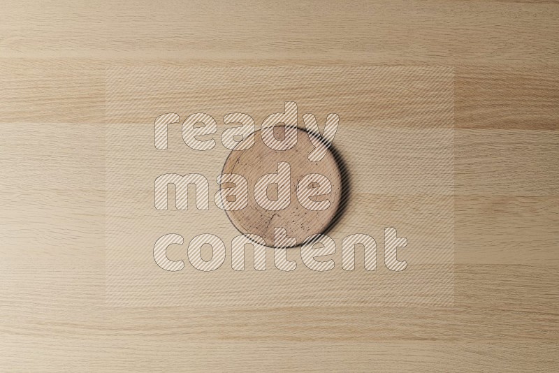 Top View Shot Of A Pottery Coaster on Oak Wooden Flooring