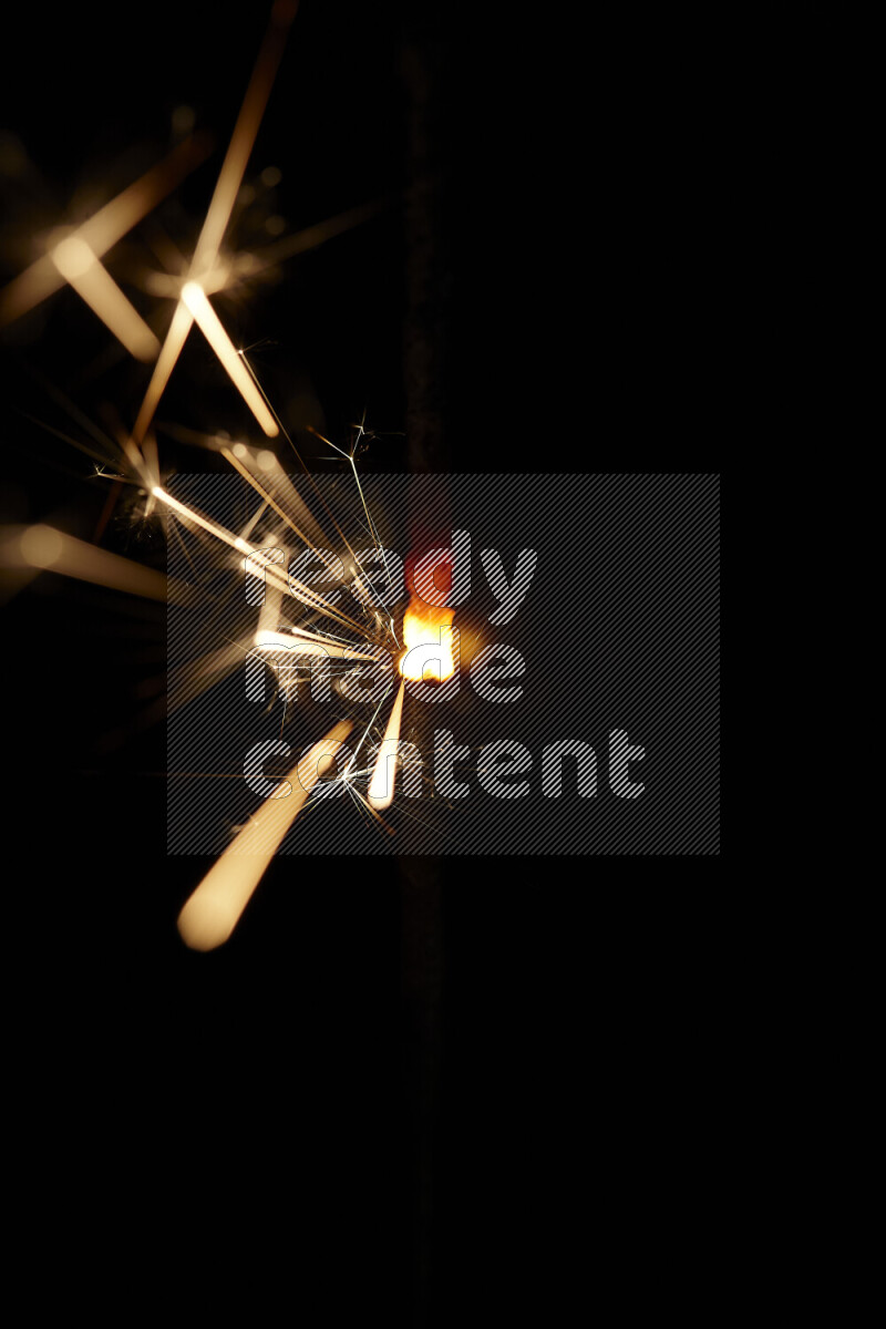 A close-up image of sparkler candle isolated on black background