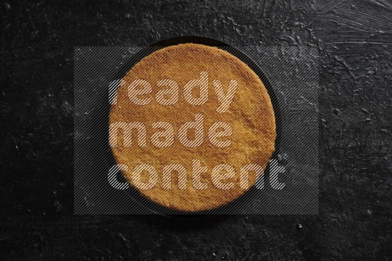 Konafa in different plates in a dark setup