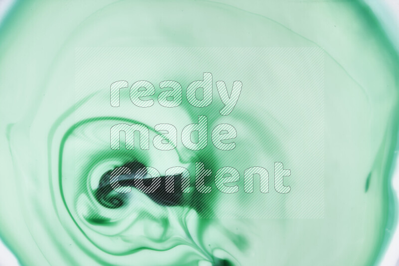 A close-up of abstract swirling patterns in green gradients