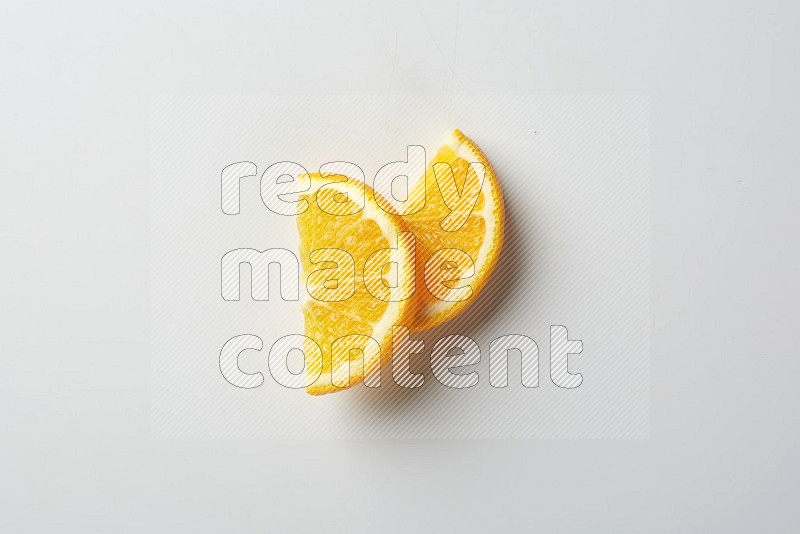 Two halves of an orange slices on white background
