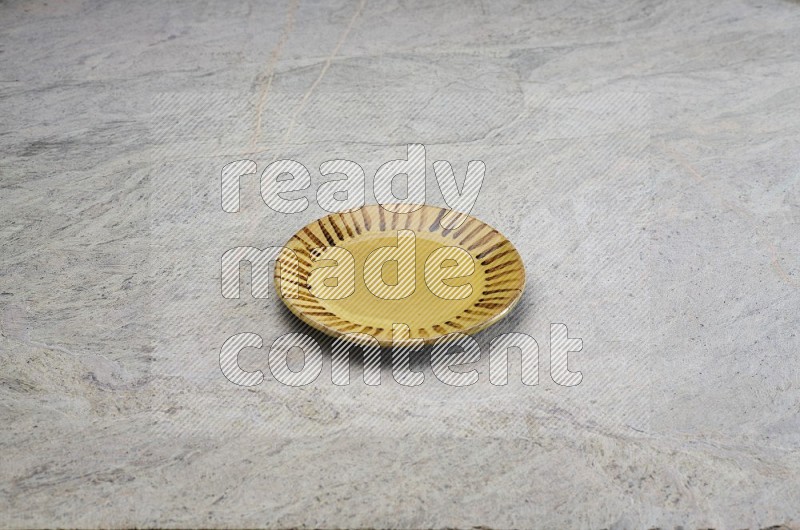 Multicolored Pottery Plate On Grey Marble Flooring