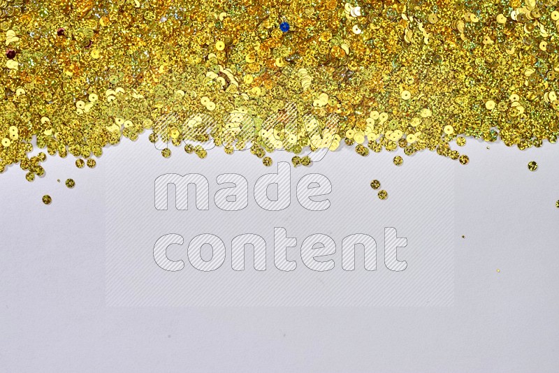 Multicolored flat sequins on grey background
