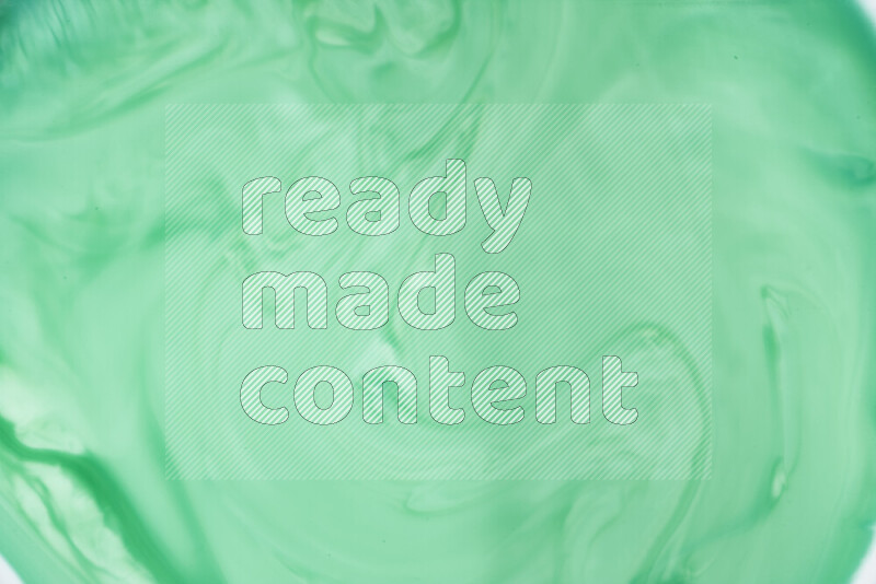 لقطة مقربة لأنماط دوامية بتدرجات اللون الأخضر