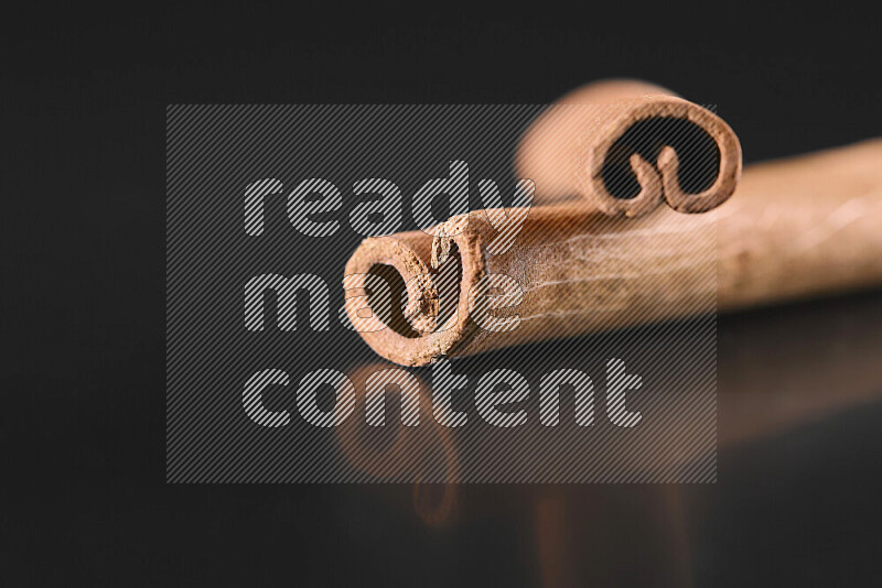 Cinnamon sticks on black background