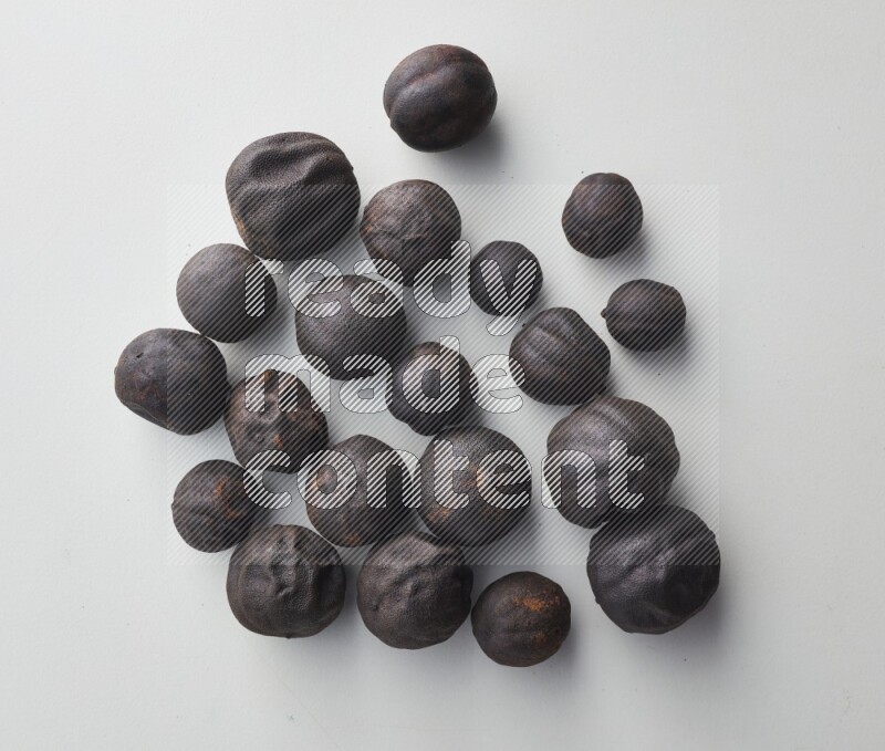 Top-view shot of dried lime (loomi) on white background