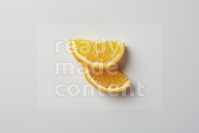 Two halves of an orange slices on white background