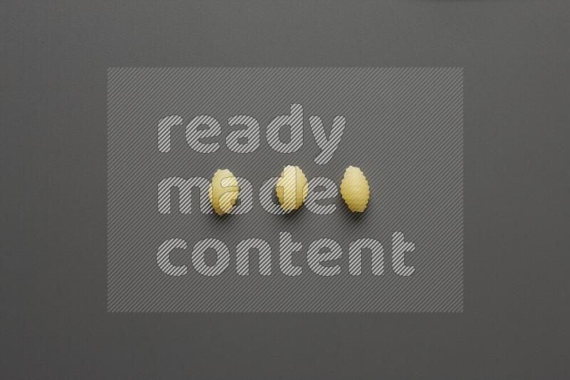 Shells pasta on grey background