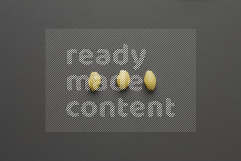 Shells pasta on grey background