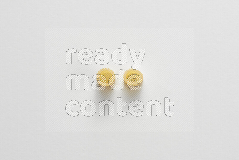 Big rings pasta on white background