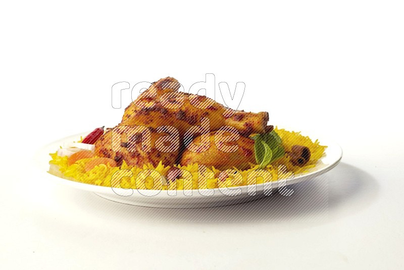 yellow basmati Rice with kabsa chicken pieces on a white rounded plate direct on white background
