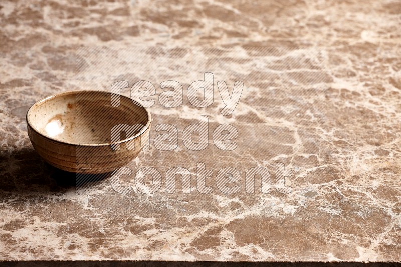 Beige Pottery Bowl on Beige Marble Flooring, 45 degrees
