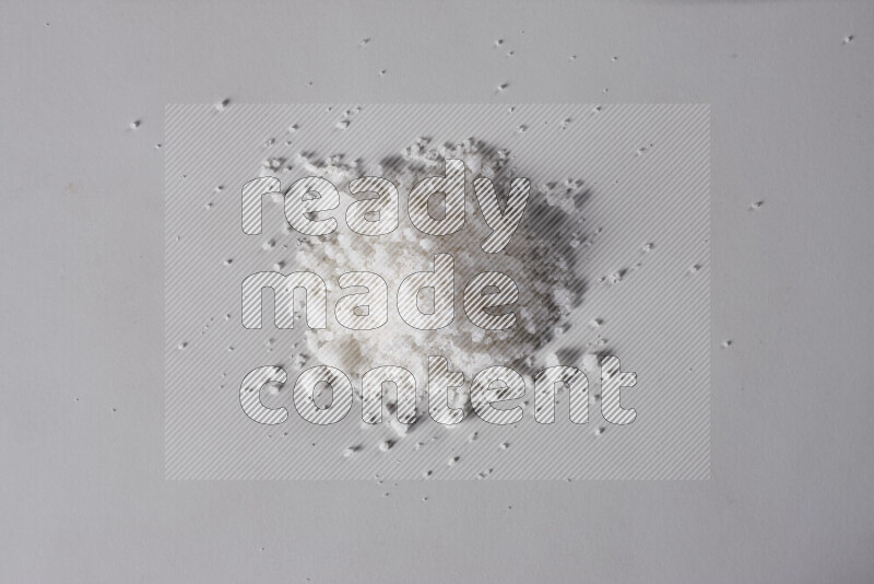 A bunch of coarse sea salt crystals on white background