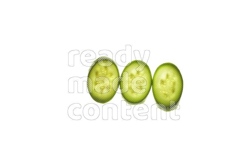 Zucchini slices on illuminated white background