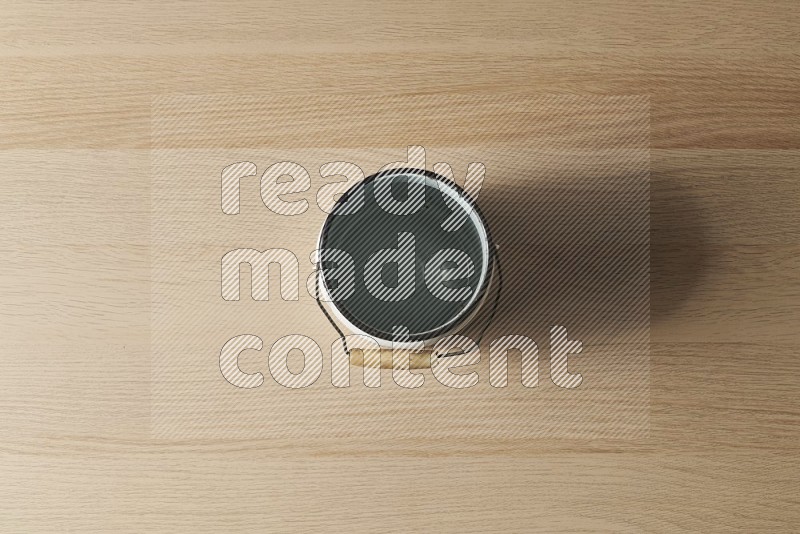 Top View Shot Of A Vintage Milk Can on Oak Wooden Flooring