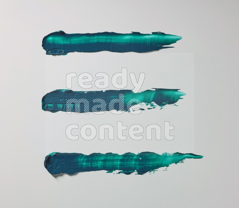 Turquoise painting knife strokes on white background