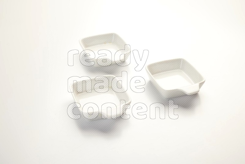 white ceramic square sauce dish on white countertop