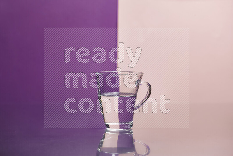 The image features a clear glassware filled with water, set against purple and rose background