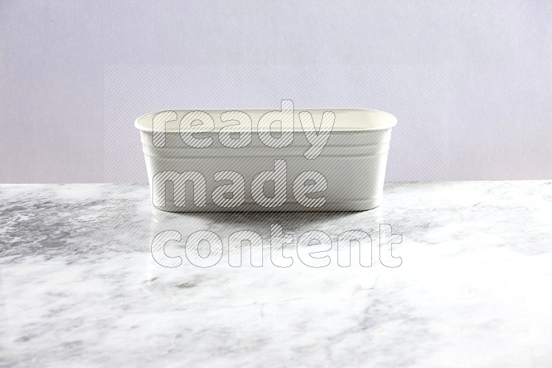 An Empty White Plant Pot on light grey Marble Flooring 45 degree angle