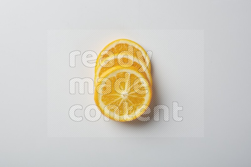 Three orange slices on a white background