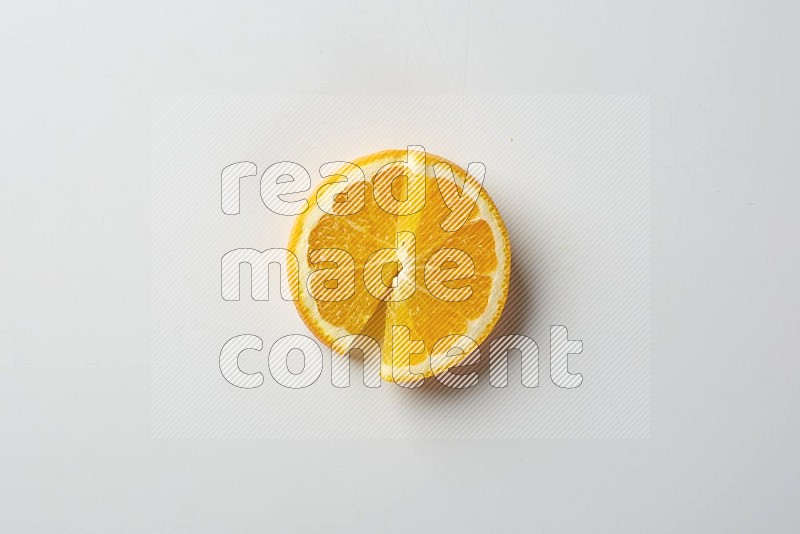 Two halves of an orange slices on white background