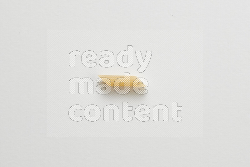 Mini penne pasta on white background