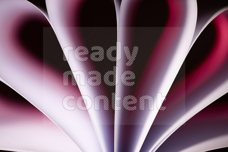 An abstract art piece displaying smooth curves in pink and red gradients created by colored light