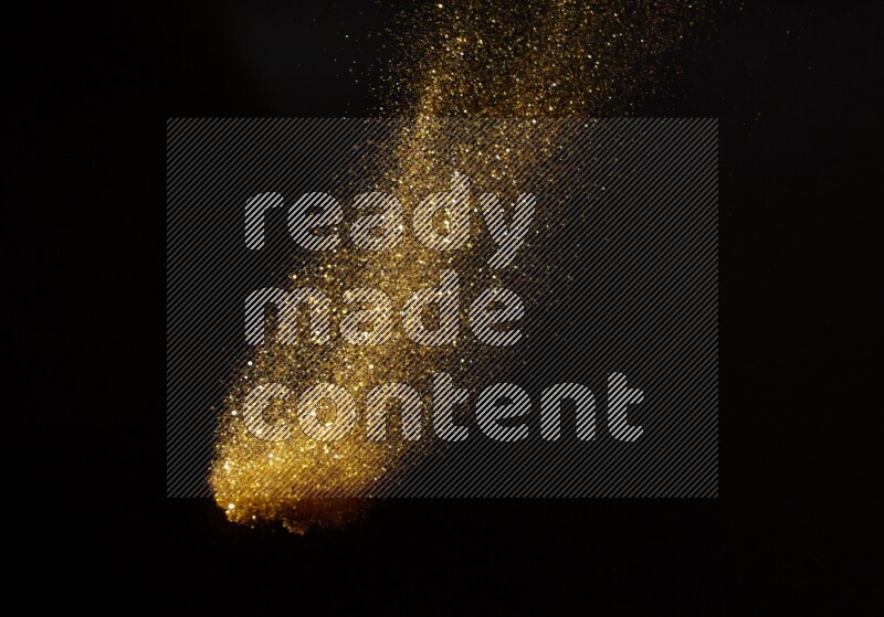 Gold glitter powder isolated on black background