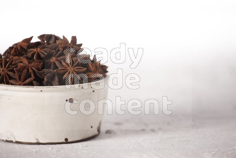 Star Anise in a white bowl on white background