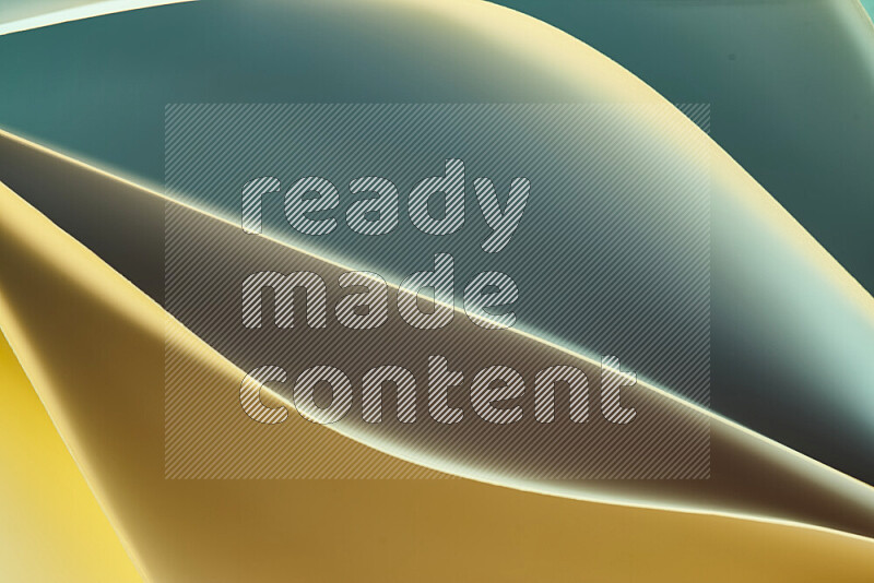 This image showcases an abstract paper art composition with paper curves in green and yellow gradients created by colored light