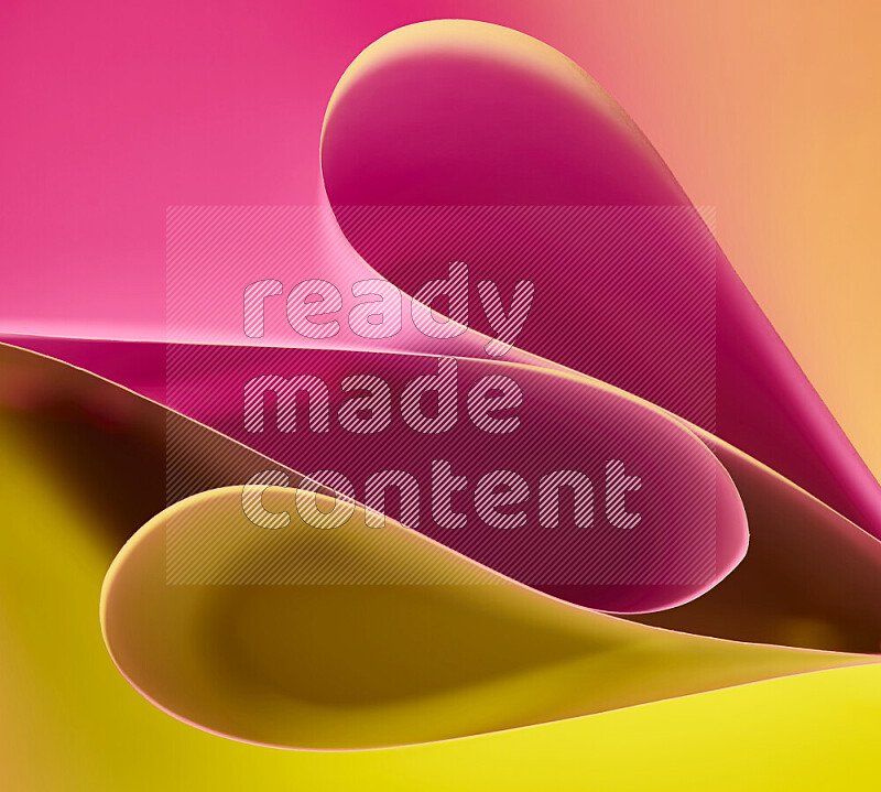 An abstract art of paper folded into smooth curves in yellow and pink gradients