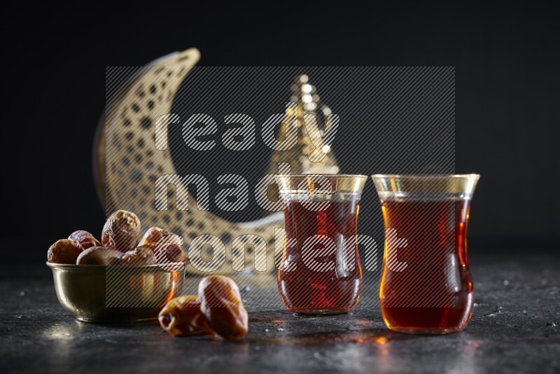 Dates with hot drinks and golden lanterns in a dark setup