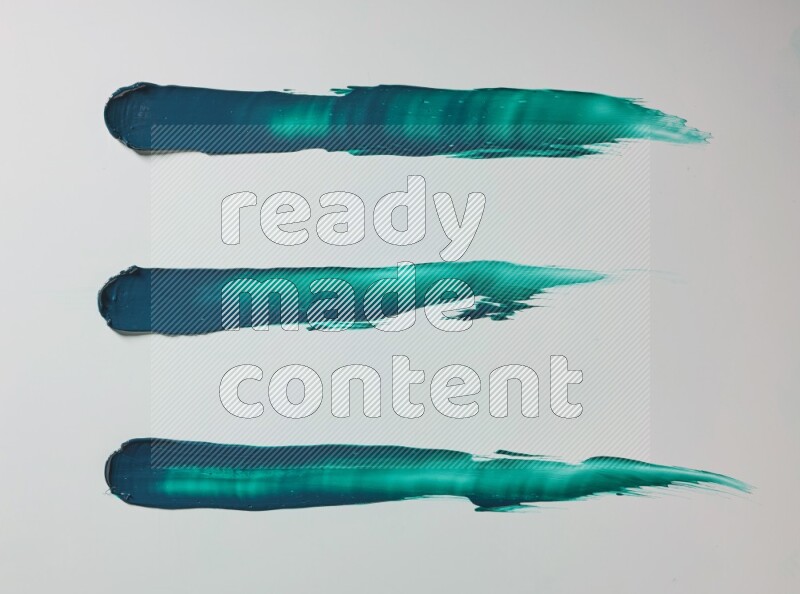 Turquoise painting knife strokes on white background