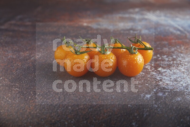 Orange cherry tomato vein on reddish rustic metal background 45 degree