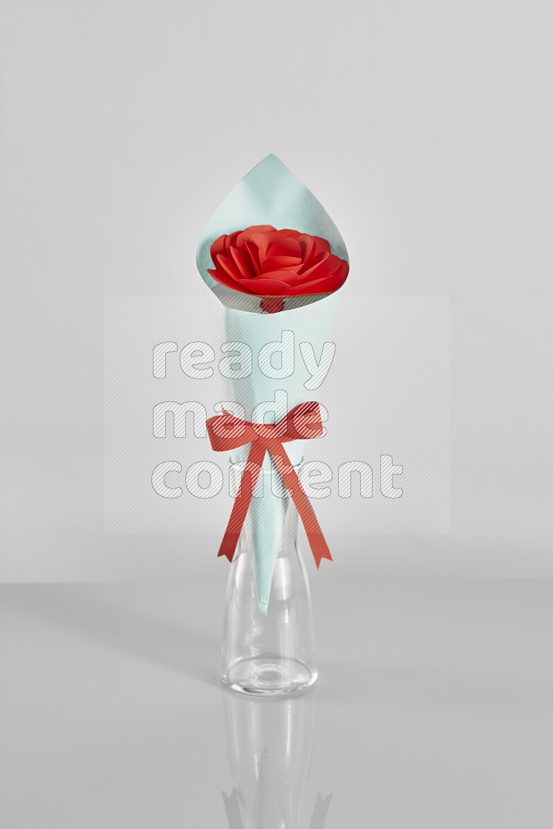 Origami flower bouquet on grey background