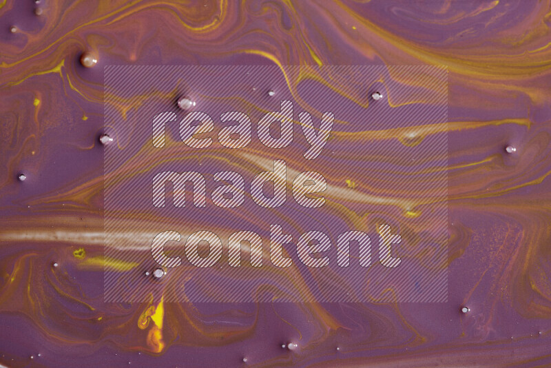 Abstract colorful background with mixed of purple and yellow paint colors