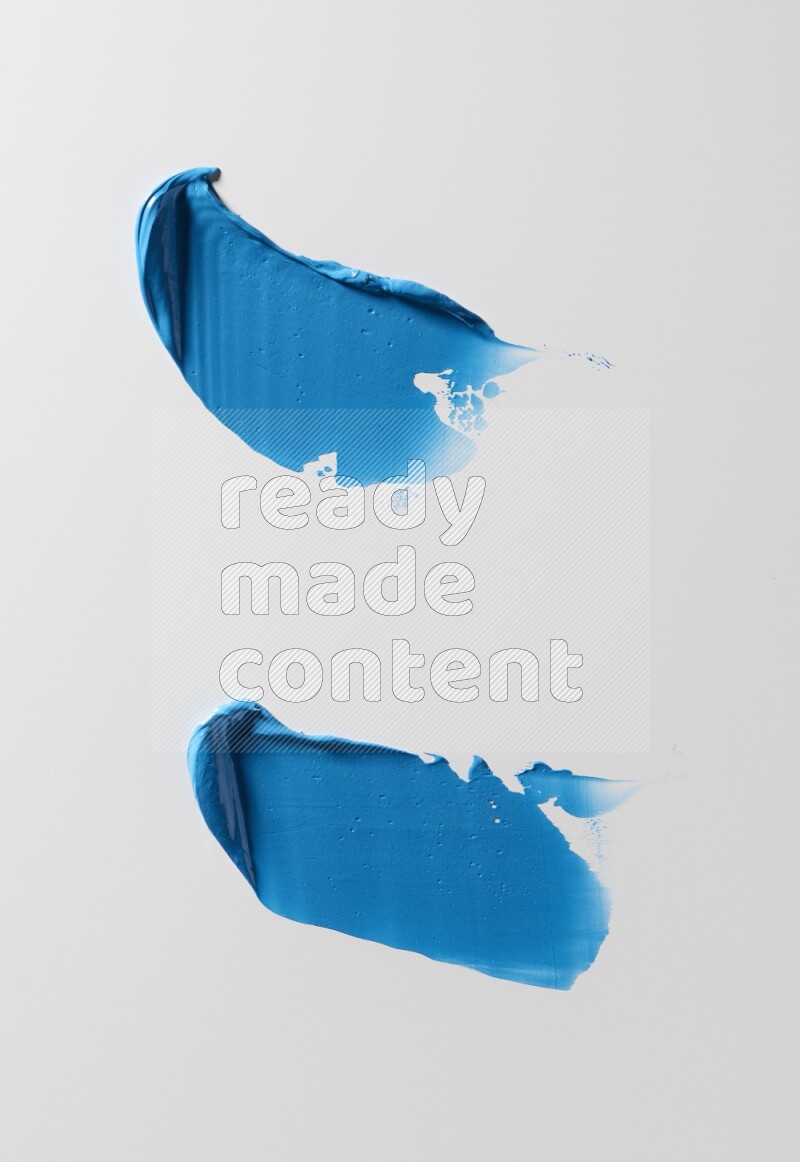 Blue painting knife strokes on white background