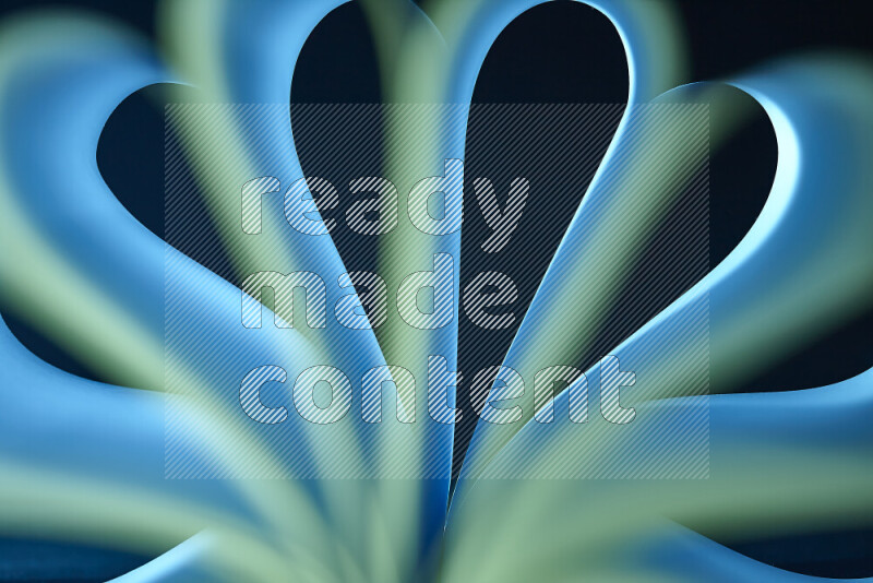 An abstract art piece displaying smooth curves in blue and green gradients created by colored light