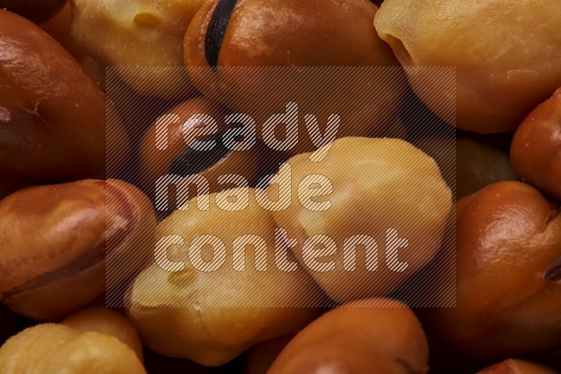 Close up shot of cooked fava beans (foul) & chickpeas on white background