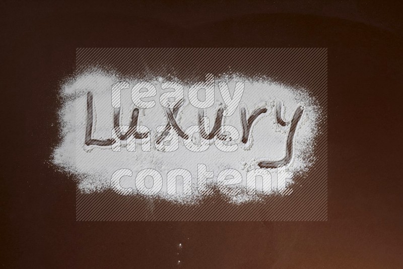 A word written with powder on brown background