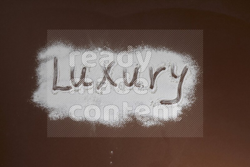 A word written with powder on brown background