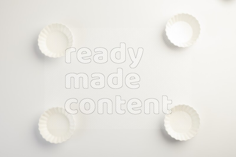 white ceramic round sauce dish on white countertop