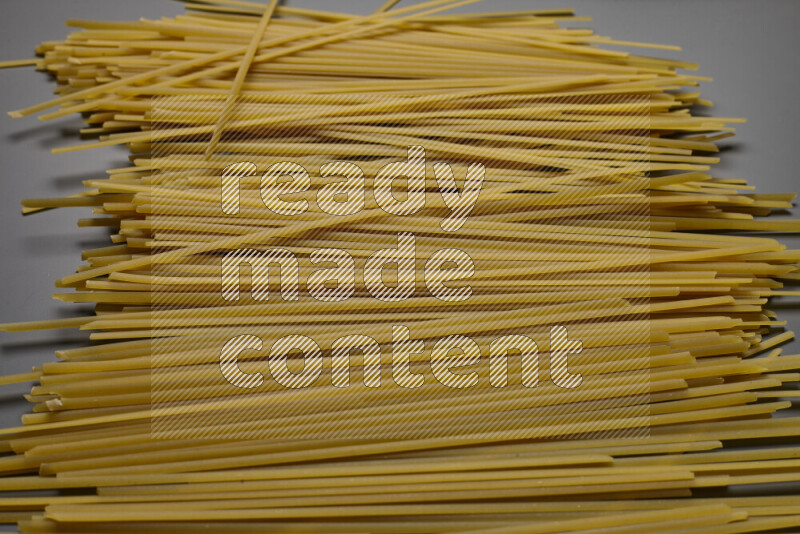 Linguini pasta on grey background
