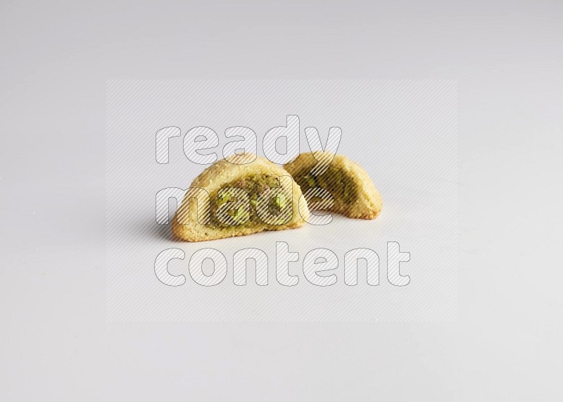 Half Maamoul filled with pistachio direct on white background